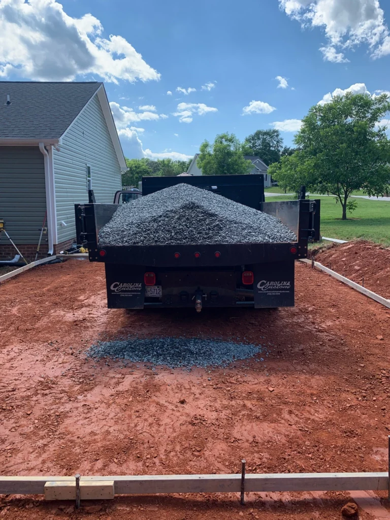 Stone base going in for a concrete driveway