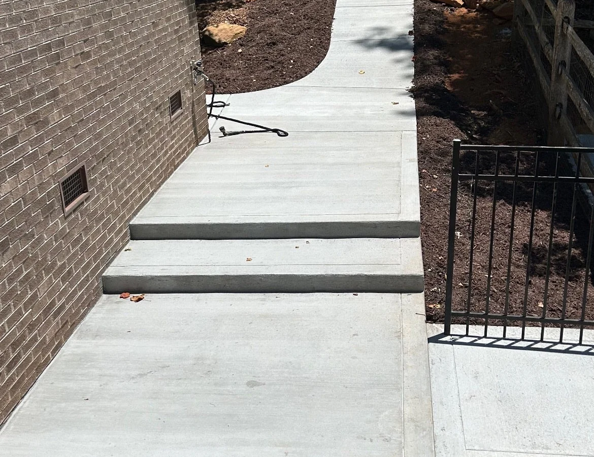 Concrete walkway at a lake house